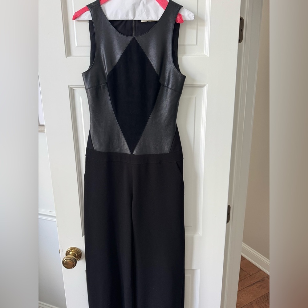Black jumpsuit by Ramy Brook. Size 6 beautifully made with cut out back.